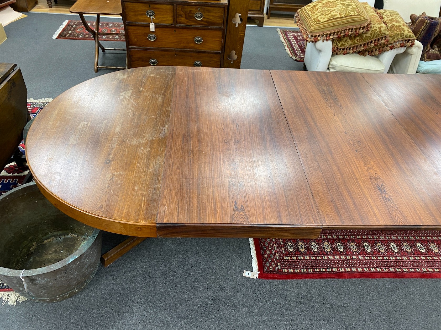 A mid century Danish design Indian rosewood extending dining table, 308cm extended, three spare leaves, width 129cm, height 72cm